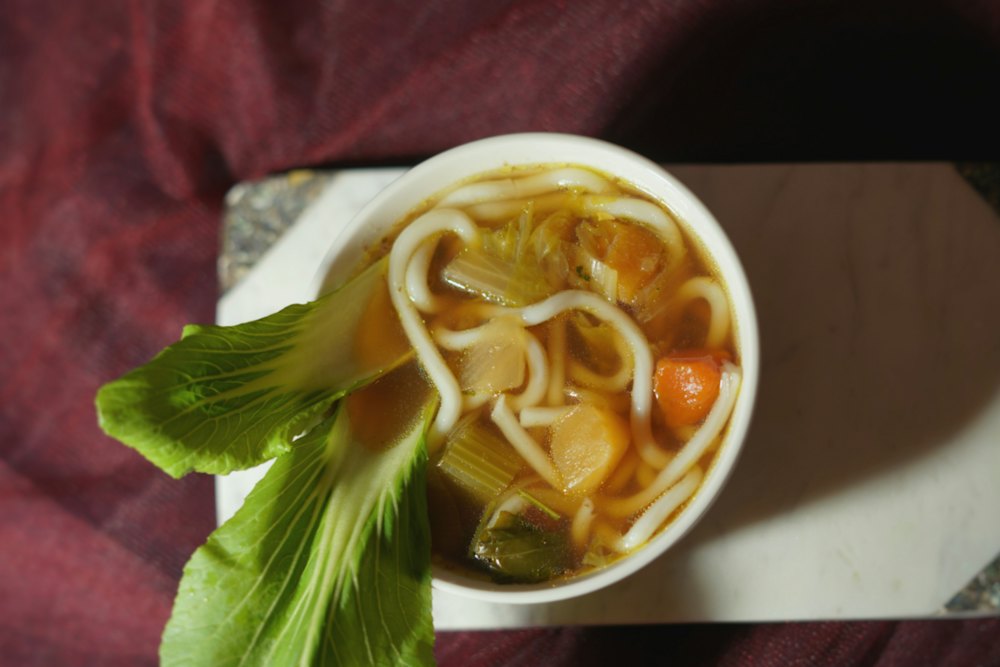 Stock photo of a bowl of chicken noodle soup